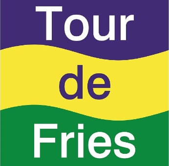 Farbenfroher Wegweiser Radweg Tour de Fries